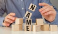 Woman made word NAME with wood blocks