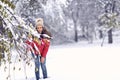 Woman in magic winter day.Young woman enjoying the snowy day