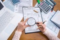 Woman magnifying 1040 form, preparing to fill Royalty Free Stock Photo