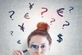 Woman with magnifying glass, currency choice Royalty Free Stock Photo