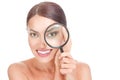 Woman with magnifying glass near eye mimic wrinkles on her face