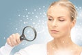 Woman with magnifying glass Royalty Free Stock Photo