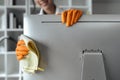 Woman maid cleaning and wiping the computer with microfiber cloth in office Royalty Free Stock Photo