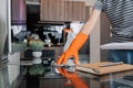 Woman housekeeper cleaning and wiping desk with microfiber cloth at home office Royalty Free Stock Photo