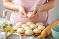 Woman make dough balls for cooking mexican flatbread.