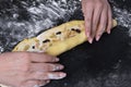 Woman make dough for sweet homemade backery on black background
