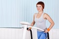 Woman make exercise on training apparatus Royalty Free Stock Photo
