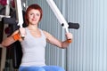 Woman make exercise on training apparatus Royalty Free Stock Photo