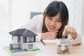 Woman make a save money for buy new house concept Royalty Free Stock Photo