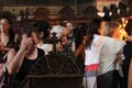 Woman make the sign of the cross and pray in church in Sofia, Bulgaria on july 27, 2012