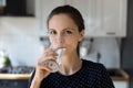 Woman make sip enjoy mineral filtered water staring at camera