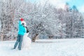 Woman make a snowman in frosty winter day Royalty Free Stock Photo