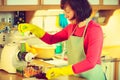 Woman make vegetables juice in juicer machine