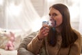 Woman makes inhalation nebulizer at home. holding a mask nebulizer inhaling fumes spray the medication into your lungs sick Royalty Free Stock Photo