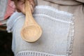 The woman makes traditional handcraft wooden spoon. - Image