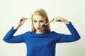 Woman with makeup brushes on face applying powder and shadow Royalty Free Stock Photo