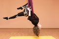 Woman making aerial yoga exercises, indoor