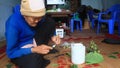 Woman making betel with betel and areca. Customs of betel chewing is longstanding in Vietnam