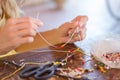 Woman making beaded bracelet crafting Royalty Free Stock Photo