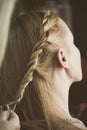 Woman making braids at hair studio Royalty Free Stock Photo