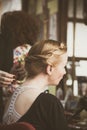 Woman making braids at hair studio Royalty Free Stock Photo