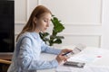 Woman making calculations and looking at documents Royalty Free Stock Photo