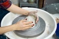 Woman making ceramic pottery on wheel, hands closeup. Concept for woman in freelance, business, creative hobby. Earn extra money, Royalty Free Stock Photo