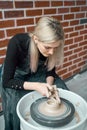 Woman making ceramic pottery on wheel, hands closeup. Concept for woman in freelance, business, hobby. Earn extra money, turning Royalty Free Stock Photo