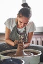 Woman making ceramic pottery on wheel, hands closeup. Concept for woman in freelance, business, hobby Royalty Free Stock Photo