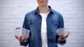 Woman making choice between bioplastic food container and non-disposable box Royalty Free Stock Photo