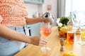 woman making cocktail drinks at home kitchen Royalty Free Stock Photo