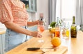 woman making cocktail drinks at home kitchen Royalty Free Stock Photo