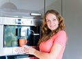 Woman making coffee cup machine kitchen interior Royalty Free Stock Photo