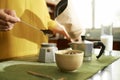 Woman making coffee with moka pot
