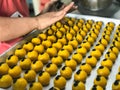 The woman is making cookies stuffed with pineapple. Royalty Free Stock Photo