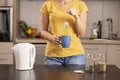 Woman making a cup of tea