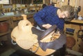 A woman making a custom made saddle