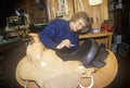 Woman making custom made western saddle Royalty Free Stock Photo