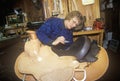 Woman making custom made western saddle, Three Forks Saddlery, Montana Royalty Free Stock Photo