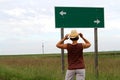 A woman making a decision at a fork in the road. Royalty Free Stock Photo