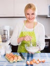 Woman making dough with whisk Royalty Free Stock Photo