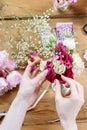 Woman making floral wedding decorations