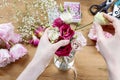 Woman making floral wedding decorations