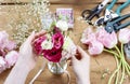 Woman making floral wedding decorations