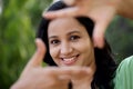 Woman making frame with her hands Royalty Free Stock Photo