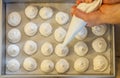Making French meringue cookies on parchment paper