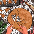 Woman making gingerbread, cutting cookies of gingerbread dough, view from above.