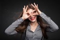 Woman making glasses out of her hands. Royalty Free Stock Photo