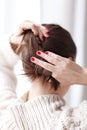 Woman making hair bun