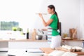 Woman making healthy food standing smiling in kitchen Royalty Free Stock Photo